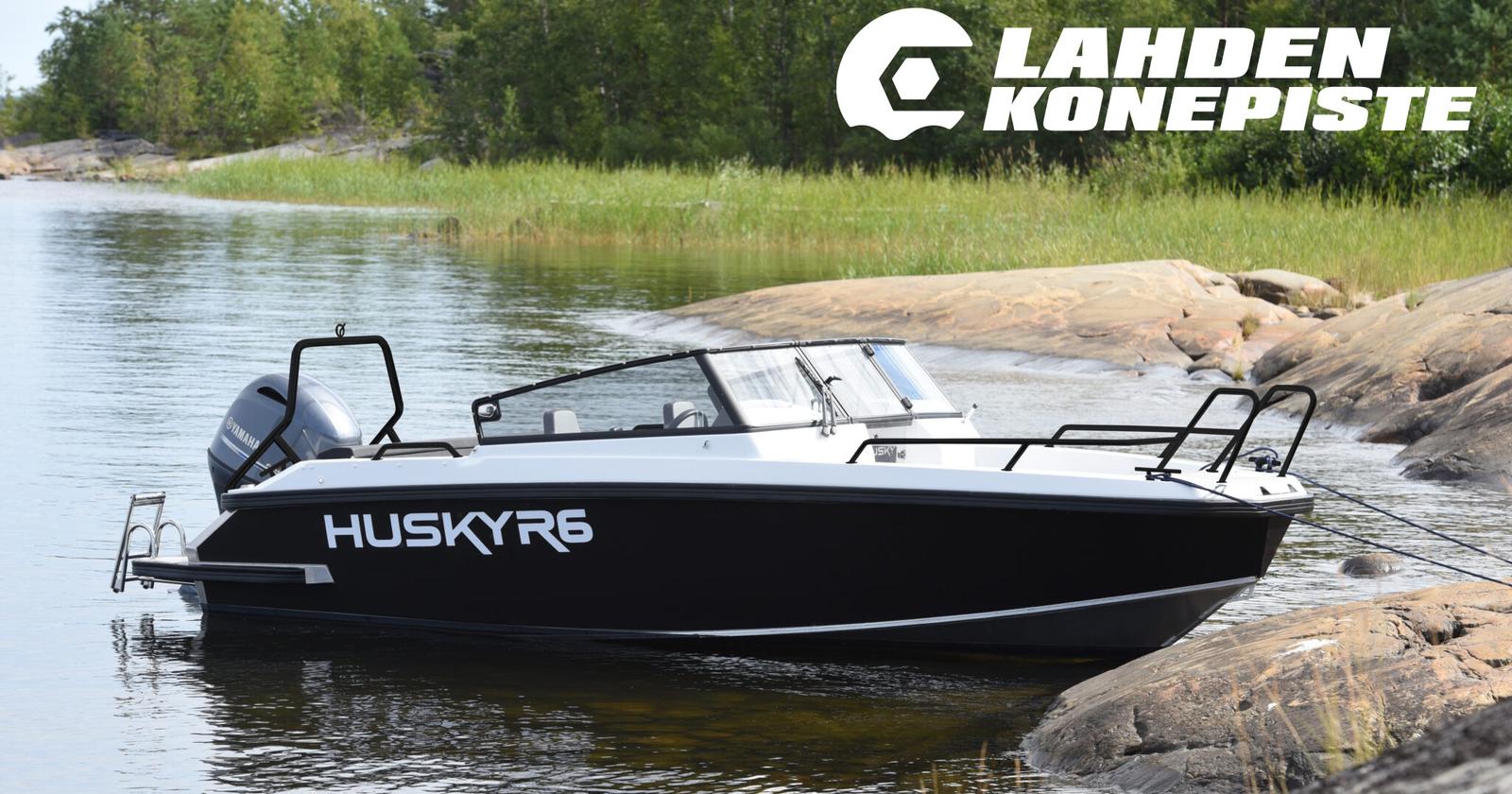 Finnmaster Husky R6 -alumiinivene rantautuneena kallioiselle rannalle